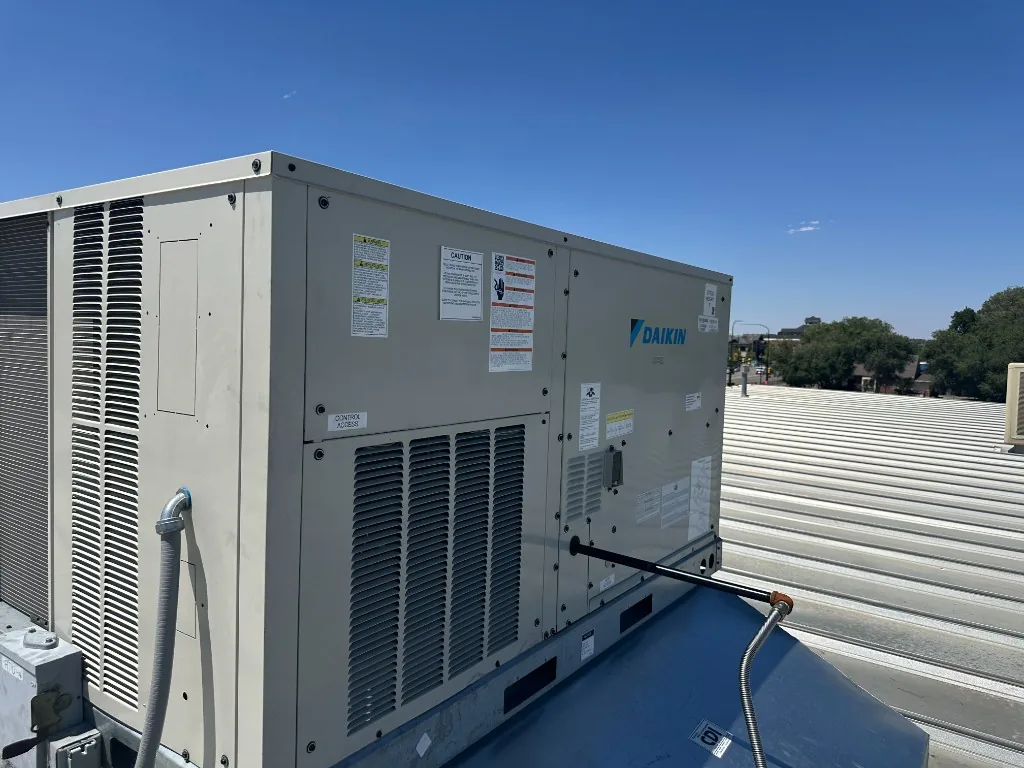 Newly-installed Daikin rooftop package unit on a commercial building along the Wasatch Front