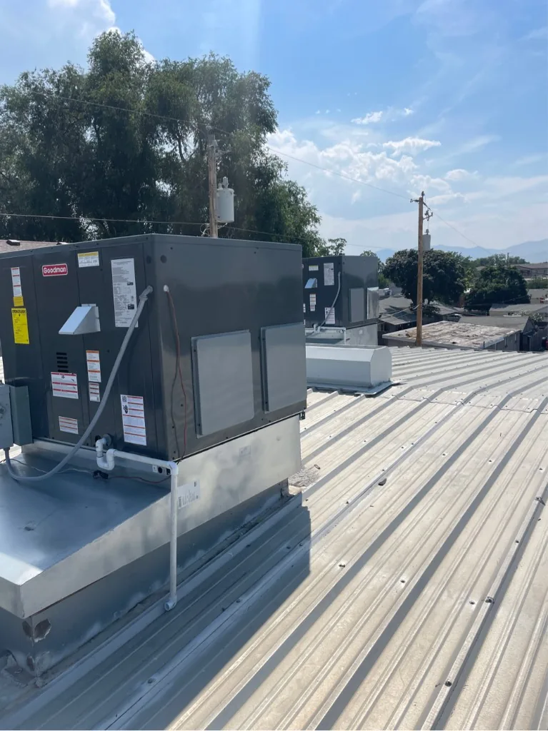 Pair of Goodman rooftop units serving a commercial property in the S.O.S service area