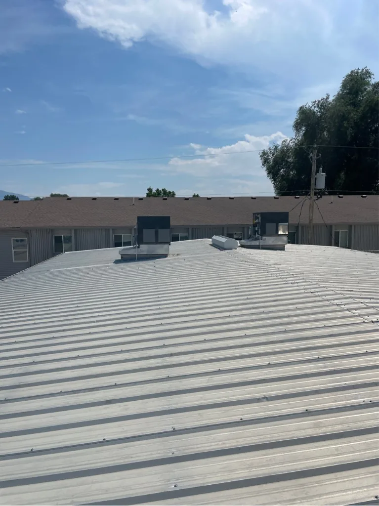 Multiple rooftop units installed across a commercial property roof in the Salt Lake area